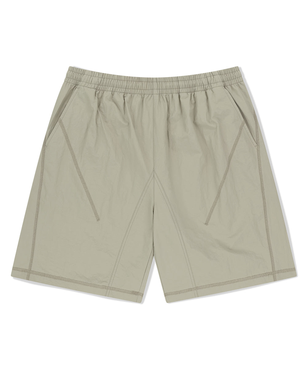 MAHAGRID COVER STITCH NYLON TRACK SHORT [BEIGE]