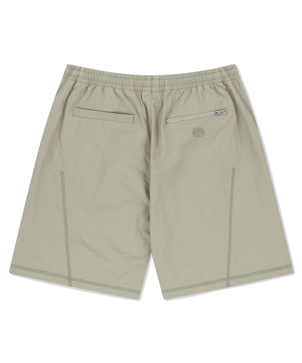 MAHAGRID COVER STITCH NYLON TRACK SHORT [BEIGE]